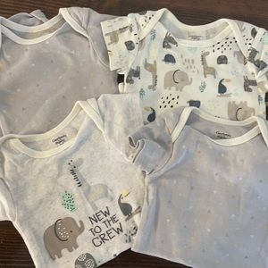 3-6 month short sleeve Gerber. Never worn. Selling together.